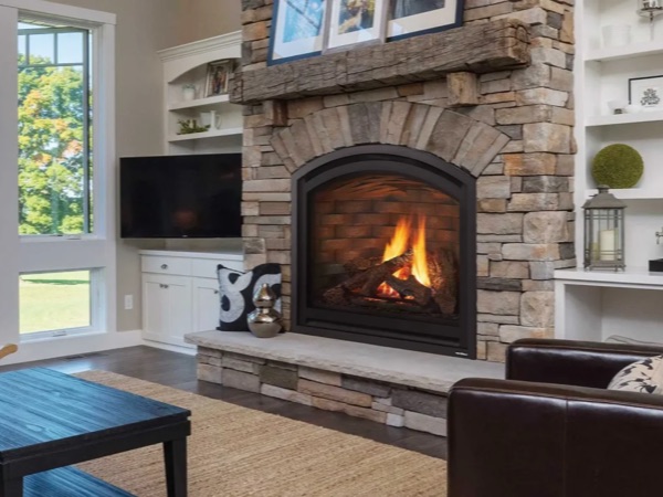 Gas fireplace insert set into a stone surround