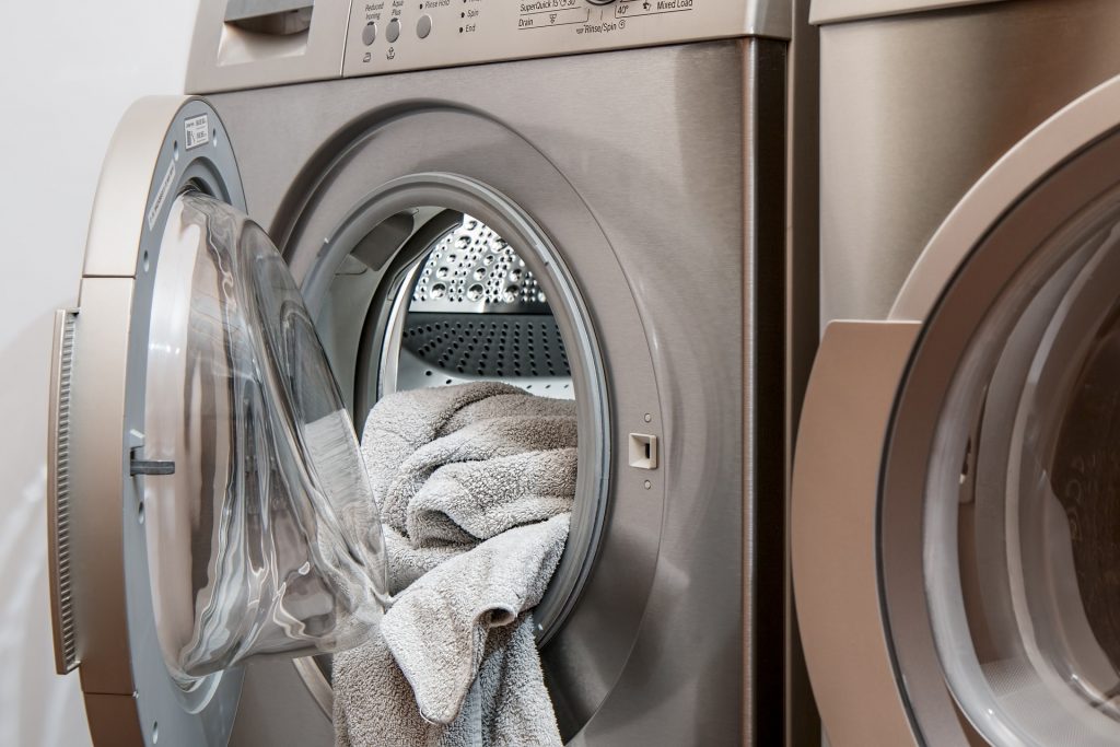 Clothing dryer open with towel inside