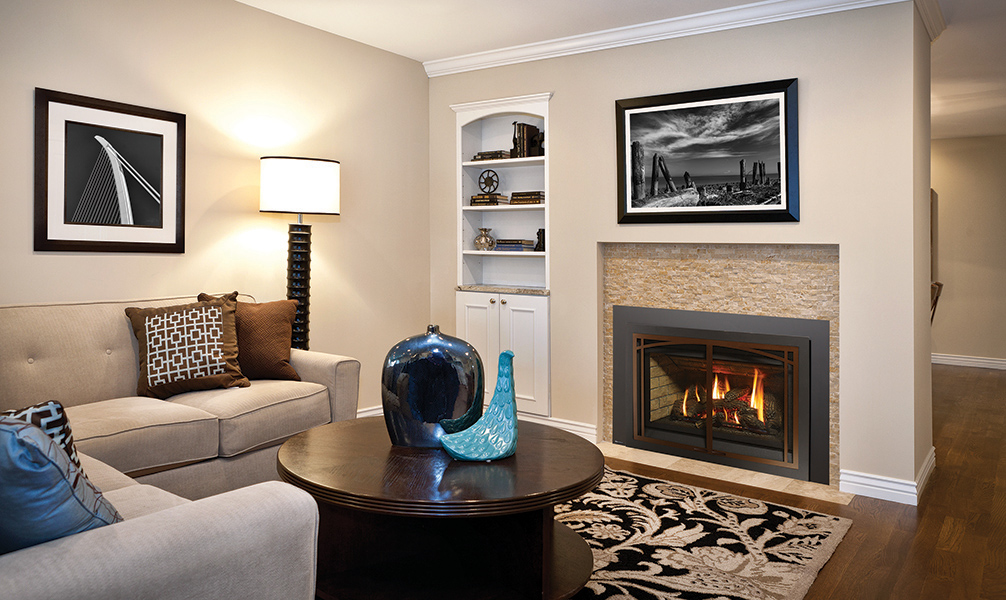 An Energy Large gas insert with a tiled surround in a living room
