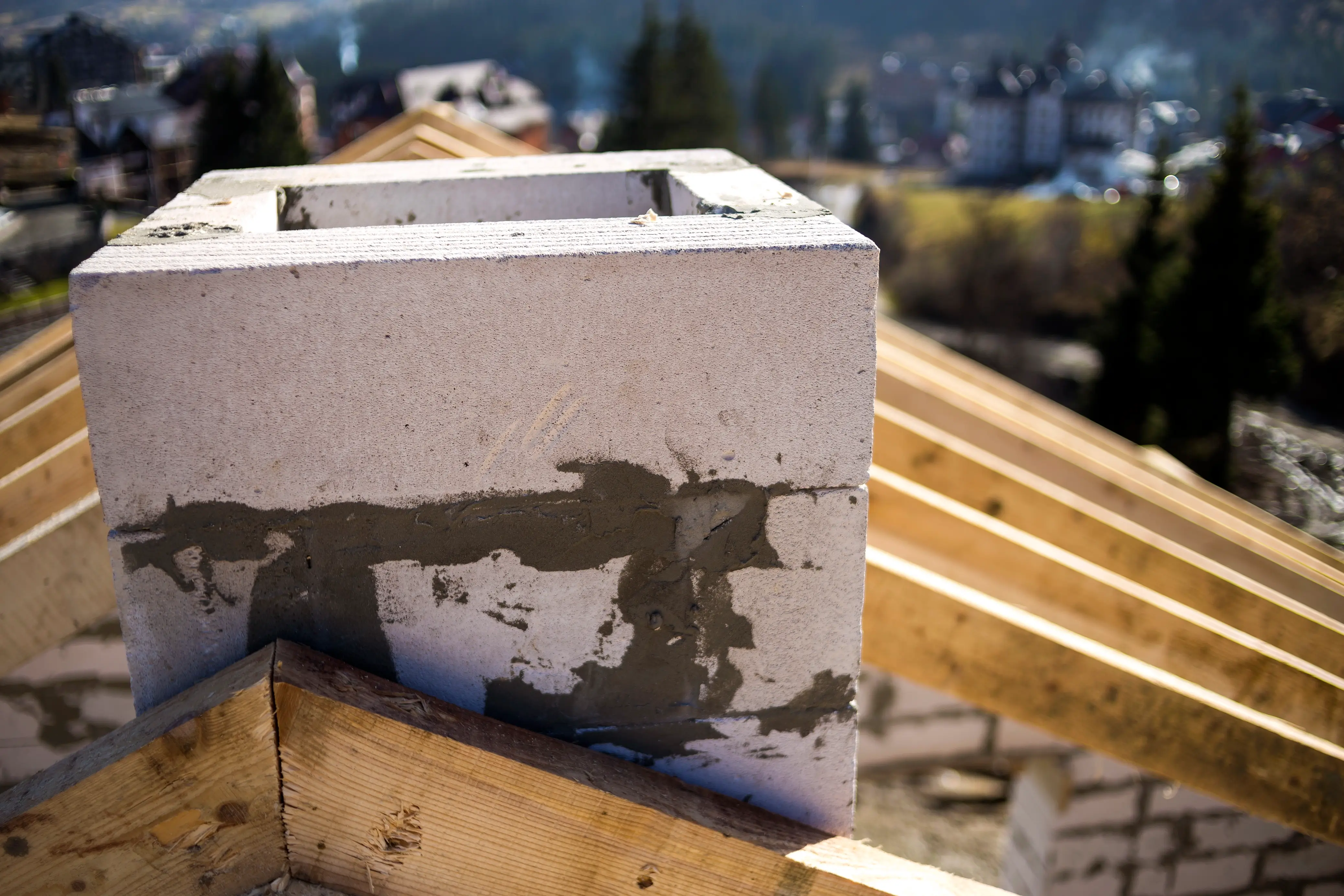 Water dripping from a chimney, indicating a leak that needs repair.